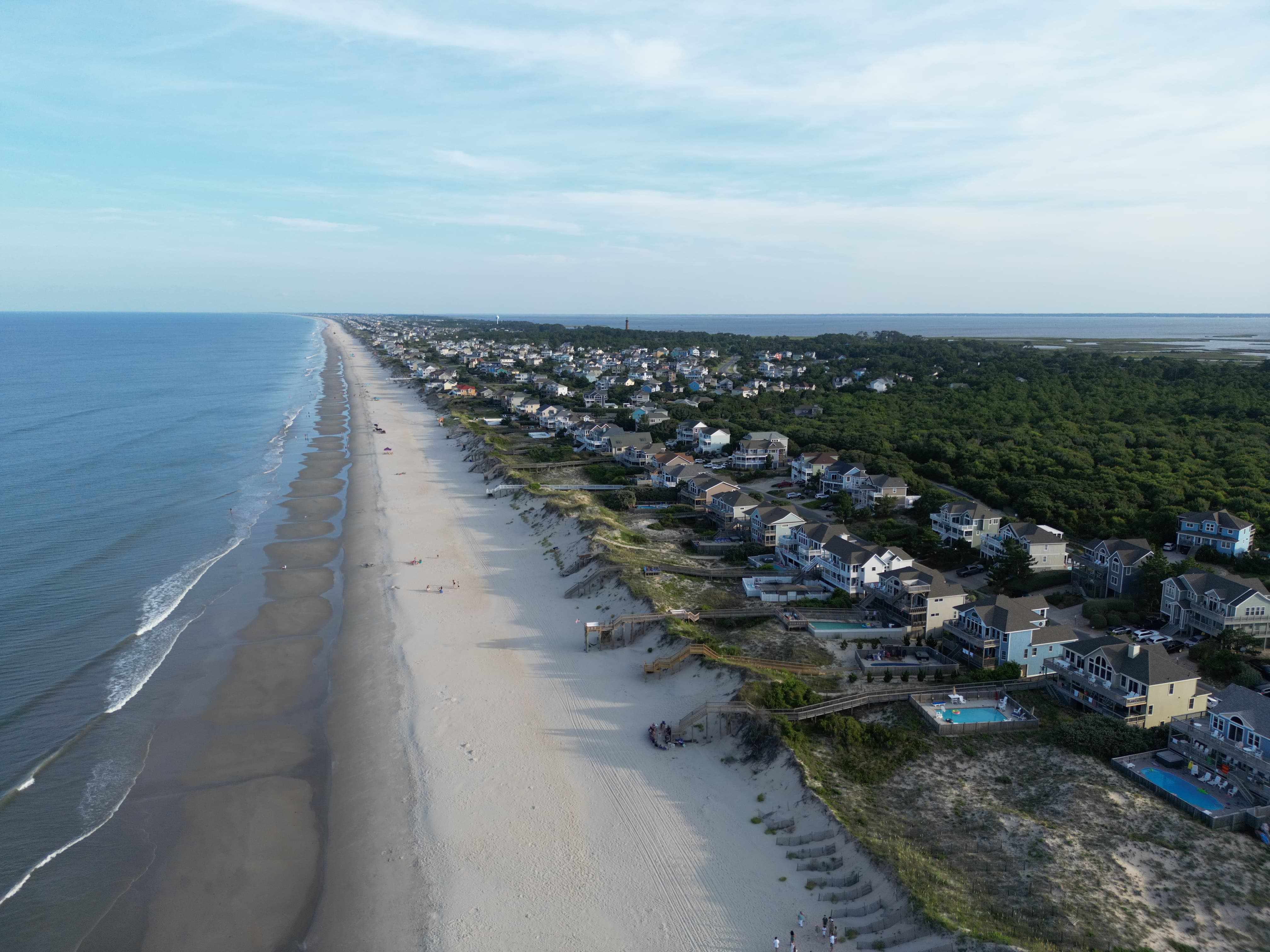 Stunning aerial view of coastal beach community showcasing professional drone photography by Mountain Scout Drone
